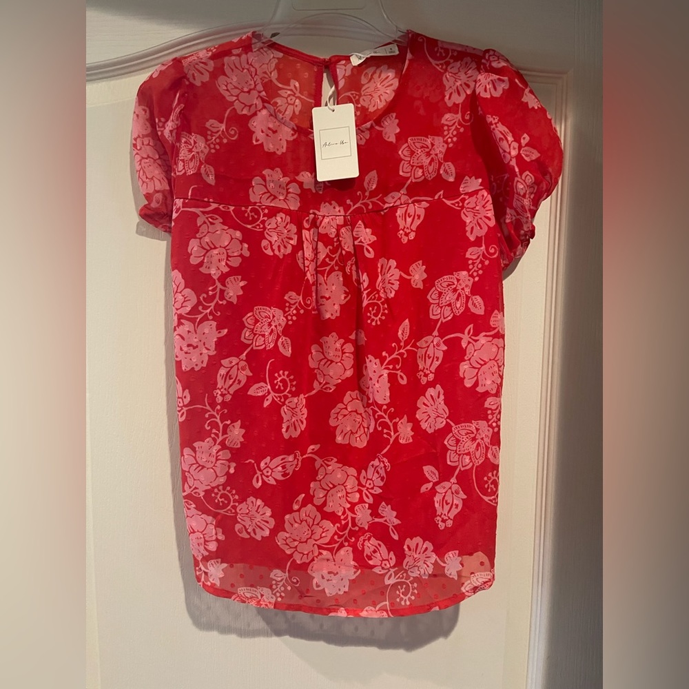 Brand new red lined top. Size small and the fit is casual, true to size.